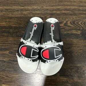 Champion slides size Men’s 8. Never worn- no tags.